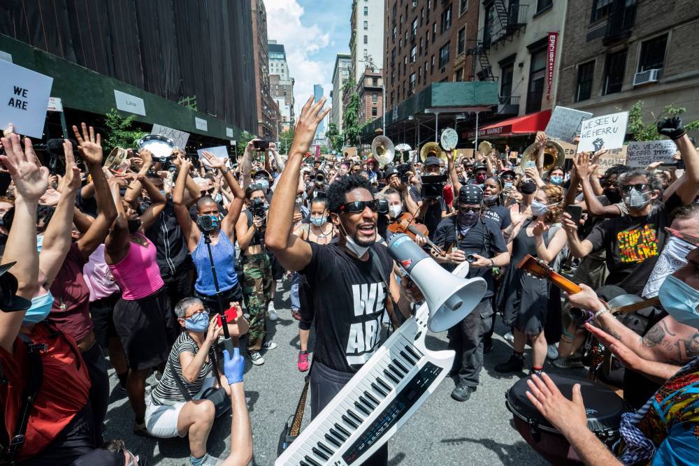 Colbert bandleader Jon Batiste heads musical march of George Floyd protesters in NYC - nypost.com
