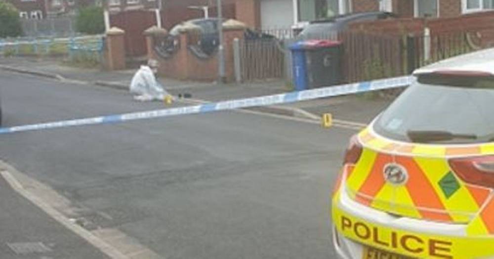 Police launch investigation after gun shots fired at window of house in Salford - www.manchestereveningnews.co.uk - Manchester