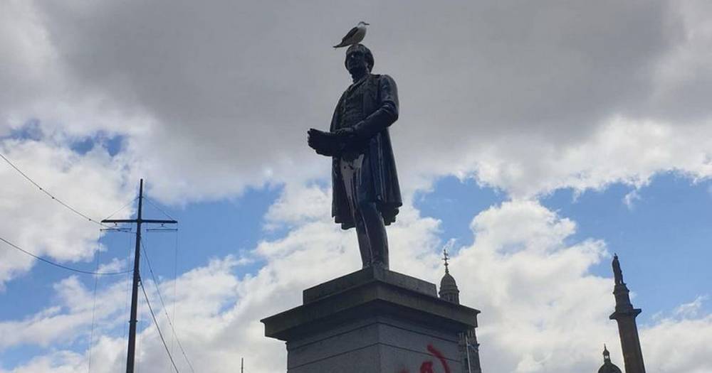 Glasgow protesters vandalise Robert Peel statue amid calls to remove Piccadilly Gardens monument - www.manchestereveningnews.co.uk - Britain - city Glasgow