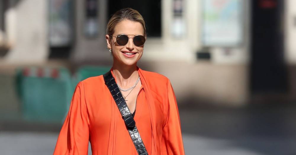 Vogue Williams shows off her blossoming baby bump in gorgeous flowing orange dress - www.ok.co.uk