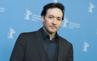 John Cusack will no longer speak to people who aren’t “aggressively” anti-Trump - www.nme.com