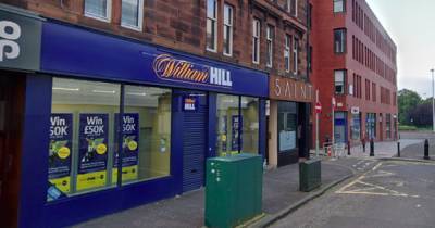 Gunman holds up Glasgow William Hill bookies as cops launch manhunt - www.dailyrecord.co.uk