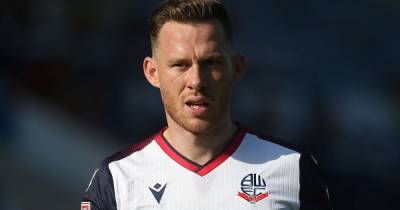 Bolton Wanderers defender Gethin Jones reacts after suffering injury and facing time out - www.manchestereveningnews.co.uk