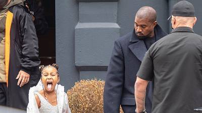 North West, 7, Hilariously Sticks Her Tongue Out At Photographers While Out With Dad Kanye - hollywoodlife.com