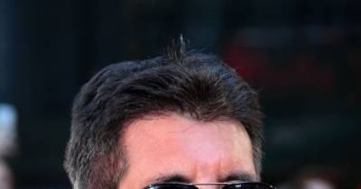 Simon Cowell could be out of commission six more months due to spinal surgery 'setback' - www.wonderwall.com - Britain - California