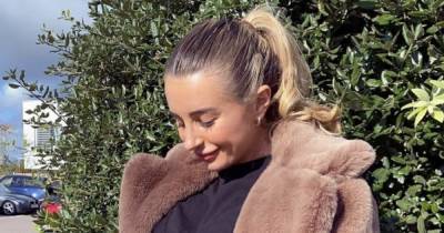 Dani Dyer cradles blossoming baby bump and marks 24 weeks after sparking speculation she's given birth - www.ok.co.uk - Britain