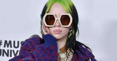 Billie Eilish looks almost unrecognisable as she swaps signature baggy clothes for beige tank top - www.ok.co.uk - Los Angeles