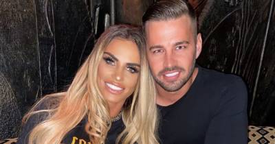 Katie Price puts on intimate display with beau Carl Woods as they touch tongues in bed in racy video - www.ok.co.uk
