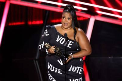 Lizzo Urges Fans To Vote — With Her Dress — As She Delivers Powerful Speech At Billboard Music Awards - etcanada.com
