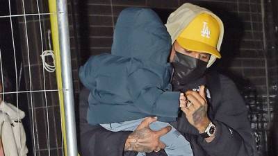 Chris Brown Cradles Son Aeko, 10 Mos., While Enjoying A Night Out In London With Ammika Harris - hollywoodlife.com - London