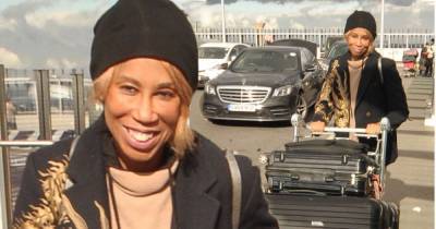 Trisha Goddard appears in good spirits as she jets home to the US - www.msn.com - USA
