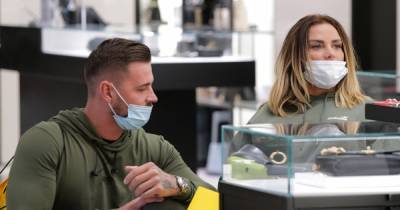 Katie Price and boyfriend Carl Woods spotted looking at rings after getting matching his and hers tattoos - www.ok.co.uk