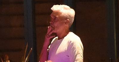 Phillip Schofield smokes a cigarette during night out after admitting he's 'confused' over his identity - www.ok.co.uk - city Richmond