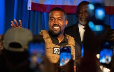 Kanye West shares video of himself holding ‘Vote Kanye’ hat over Kamala Harris’ head during vice presidential debate - www.nme.com - USA