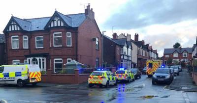 Man fighting for life in hospital after police called to house in Wigan - www.manchestereveningnews.co.uk