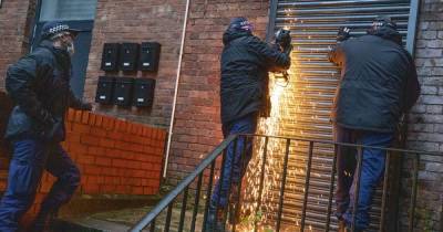 Four men arrested after police swoop on property in Strangeways raid - www.manchestereveningnews.co.uk - Manchester