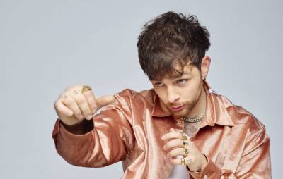 Watch Tom Grennan come out fighting in the cinematic video for his latest single ‘Amen’ - www.nme.com