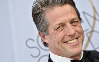 Hugh Grant says COVID-19 symptoms made him “want to sniff strangers’ armpits” - www.nme.com