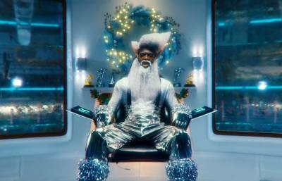 Lil Nas X Transforms Into Futuristic Santa Claus In New ‘Holiday’ Music Video - etcanada.com - city Santa Claus - Santa