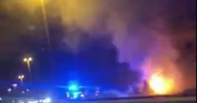 Vehicle is engulfed in flames on the Airport Relief Road - www.manchestereveningnews.co.uk - Manchester