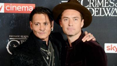 Jude Law Reacts to Johnny Depp's 'Fantastic Beasts' Role Being Recast (Exclusive) - www.etonline.com