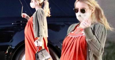 Emma Roberts drapes bulging bump in scarlet floral maxi dress - www.msn.com