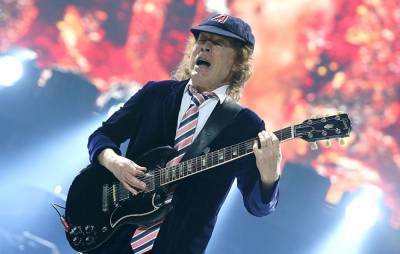 AC/DC’s Angus Young recalls first time he heard Jimi Hendrix’s music: “I was so excited” - www.nme.com