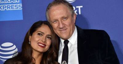 Salma Hayek wows in hot pink swimsuit in rare family photo with husband and daughter - www.msn.com