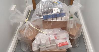 Thousands of illegal cigarettes and 'laughing gas' canisters seized in Bolton raids - www.manchestereveningnews.co.uk