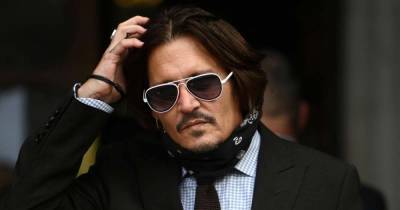 Dior sticks by Johnny Depp in defiance of 'wife beater' ruling - www.msn.com - Britain - USA
