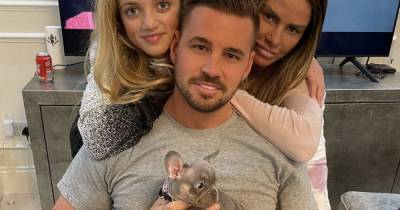 Katie Price’s boyfriend Carl Woods slams trolls criticising puppy Rolo’s death as they pose with new dog - www.ok.co.uk