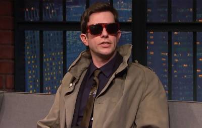 The Strokes’ Julian Casablancas gave John Mulaney his trench coat as a ‘SNL’ parting gift - www.nme.com