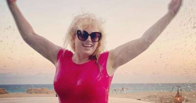 Rebel Wilson bares her abs in sports bra and shorts - www.msn.com - Australia