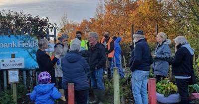 Protesters stop workmen fencing off fields as row between university and residents rumbles on - www.manchestereveningnews.co.uk - Manchester