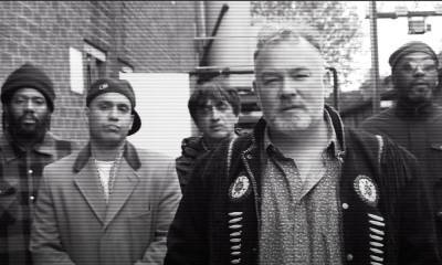 Watch Stewart Lee front Asian Dub Foundation for ‘Comin’ Over Here’ video - www.nme.com