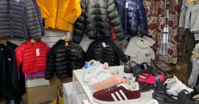 'Counterfeit clothes shop' in Strangeways with 'no Covid safety measures' shut down following raid - two men have been arrested on suspicion of immigration offences - www.manchestereveningnews.co.uk - Manchester