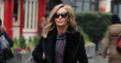 Amanda Holden teams her Christmas Jumper Day knit with a daring leather skirt - and we love her for it - www.msn.com - county Ashley - county Roberts