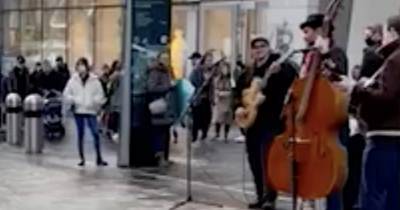 Shocking moment yob appears to pinch Glasgow buskers' cash before losing false teeth - www.dailyrecord.co.uk