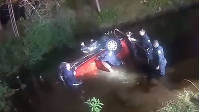 Florida family trapped inside overturned car in canal rescued by police, firefighters and good Samaritan - www.foxnews.com - Florida