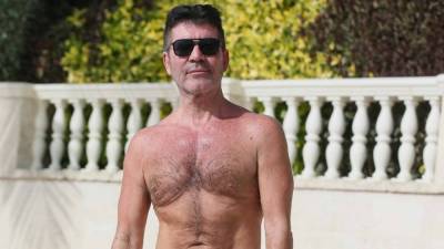 Simon Cowell Rides Jet Ski 4 Months After Breaking Back in Bike Accident - www.etonline.com - Britain - Barbados