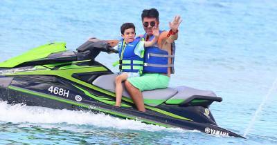 Simon Cowell enjoys jet ski ride with son Eric in Barbados four months after breaking his back in accident - www.ok.co.uk - Barbados