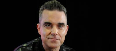 Singer Robbie Williams Says He Almost Died From Eating Too Much Fish - www.justjared.com