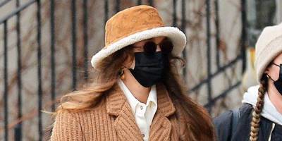Gigi Hadid Looks Chic in a Louis Vuitton Bucket Hat for a Shopping Trip with Her Baby Daughter - www.harpersbazaar.com - New York