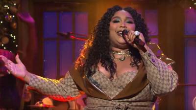 Lizzo Surprises Her Mom With a Luxury SUV for Christmas - www.etonline.com