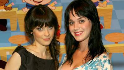 Katy Perry Says She Used to Pretend to Be Zooey Deschanel to Get Into Clubs - www.etonline.com - Los Angeles
