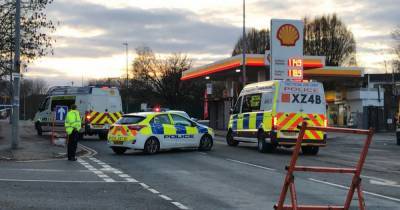 Police raid homes across Salford after man shot near petrol station - www.manchestereveningnews.co.uk - Manchester