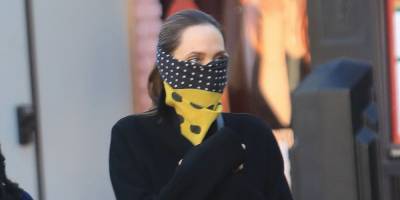 Angelina Swaps a Face Mask for a Silk Scarf in Los Angeles - www.harpersbazaar.com - Los Angeles - county Pitt - county Angelina