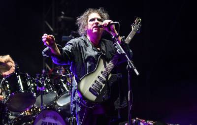 Watch The Cure’s Robert Smith play new versions of ‘Faith’ songs for charity livestream - www.nme.com - Santa