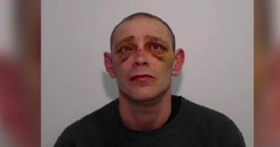 Raging thug stabbed wife's new partner while son battered victim's head with hammer - www.dailyrecord.co.uk - Manchester