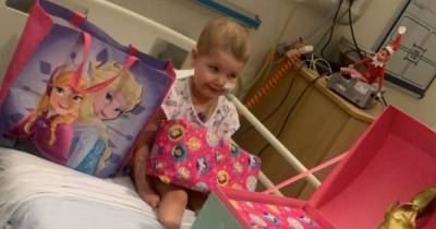 Scots tot with cancer 'overwhelmed' as she opens Christmas presents at Glasgow hospital gifted through charity - www.dailyrecord.co.uk - Scotland